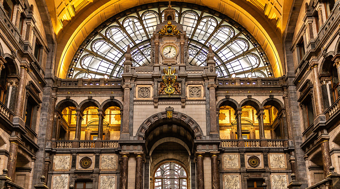 A palatial staircase entrance to a station